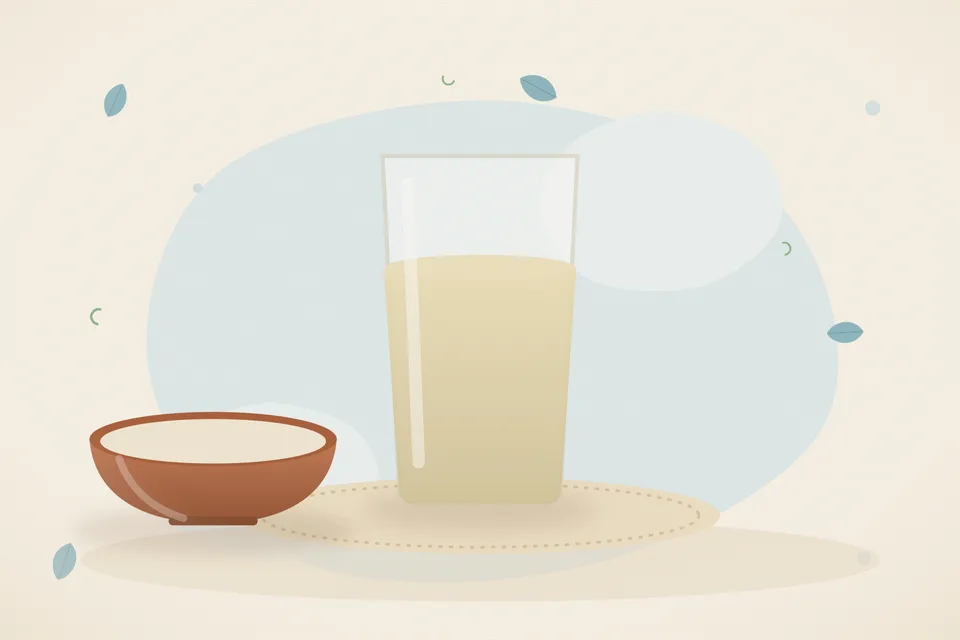 A glass of water on a kitchen counter beside an open doorway, soft daylight, no person and no lettering.